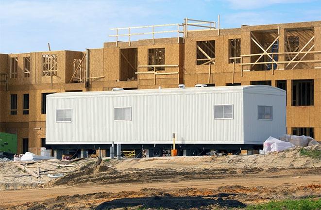 construction workers discussing plans in a rental office in Lecanto